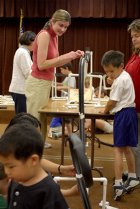 Mrs. Vanek, Matthew, and Arnoldo's mom test their coaster