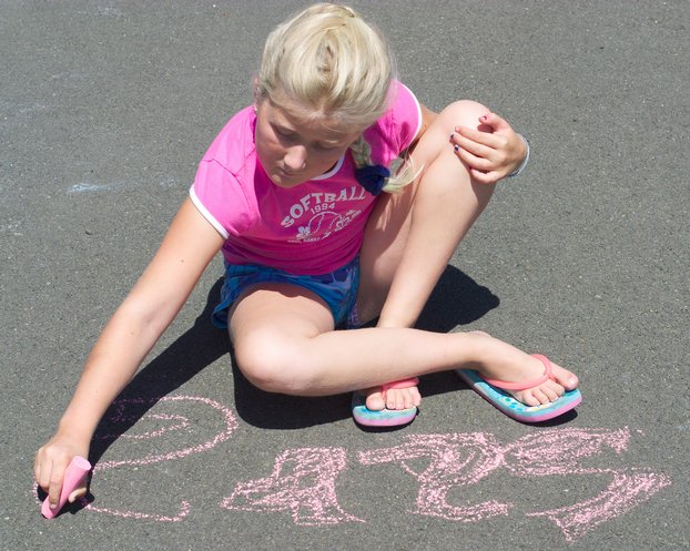 Sara drawing her name