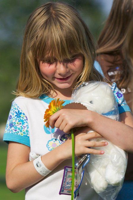 Misha with flower, patches, and bear