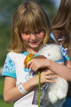 Misha with flower, patches, and bear