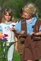 Misha watches Sara choosing her flower