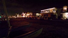 Parade viewers lined up along the beach