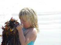 Sara holds some seaweed