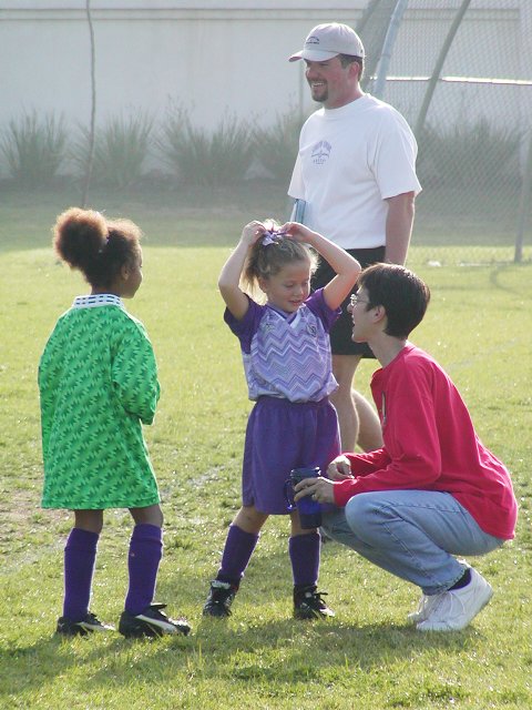 Beth chats with Walden and Chandler at halftime
