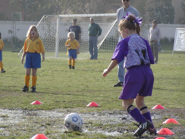 Natalie about to kick a mudball