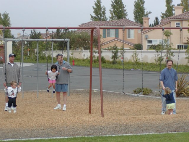 ...while the daddies swing their kids