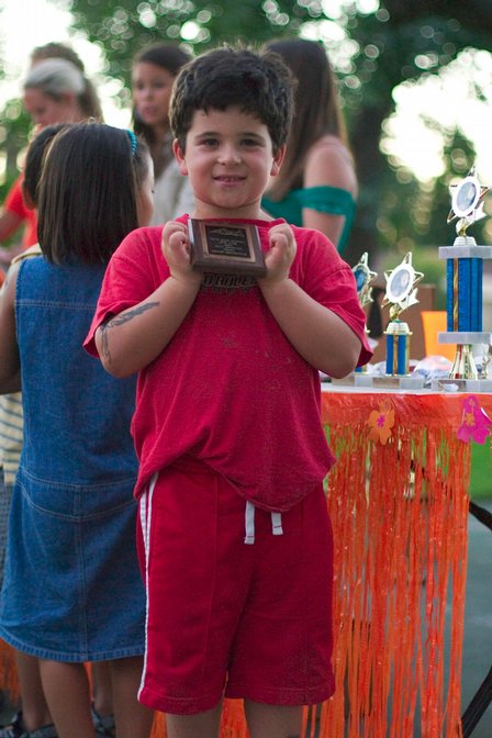 Noah shows off his improvement award