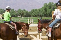 Sara and Diana head out for a one-hour horseback ride