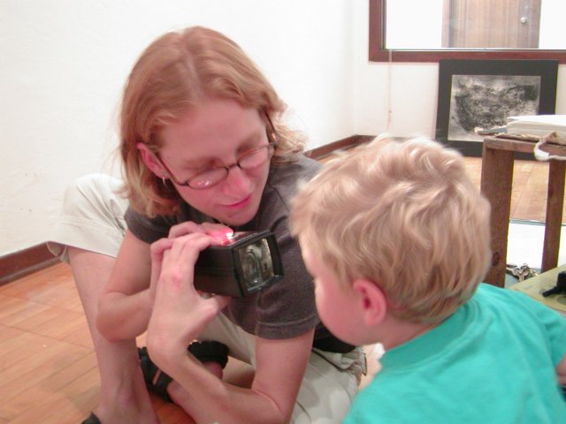 Stephanie shows some slides to Timothy