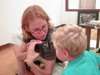 Stephanie shows some slides to Timothy