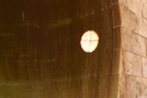 Water and light through the same hole