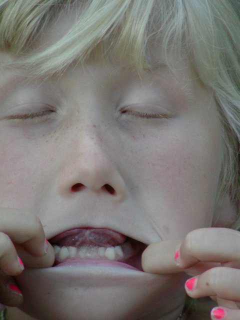 Sara mugs for the camera, VI