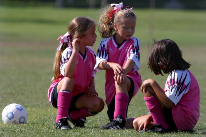 Frankie, Chandler, and Maryam kneeling for a Dynamite injury