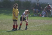 Two Fire Eagles chat in the backfield