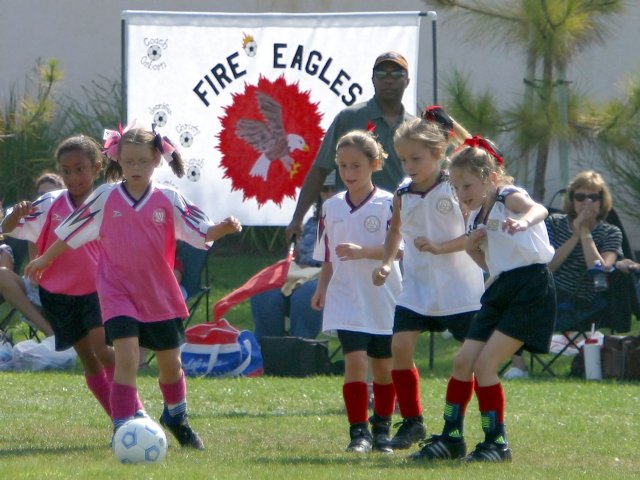 Play passes the Fire Eagles' banner