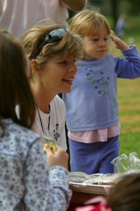 Debby hands out cupcakes for Natalie's birthday