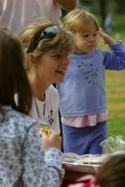 Debby hands out cupcakes for Natalie's birthday