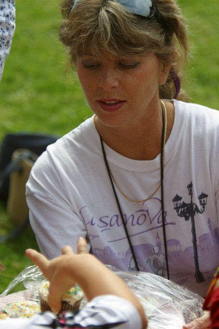 Debby handing out cupcakes