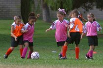 Walden defends as a Tiger comes in from behind