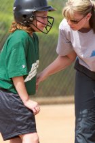 Dragon coach consoles a hurt player