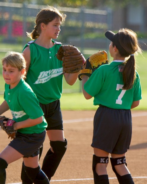 Jennifer and Kayla congratulate Breanna on a strikeout