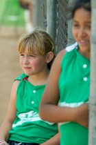Jennifer and Ashley watch from the dugout door