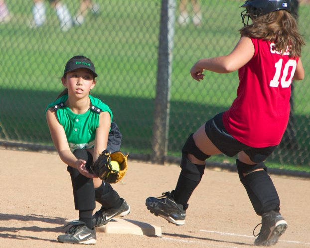 Kayla makes a close play at first