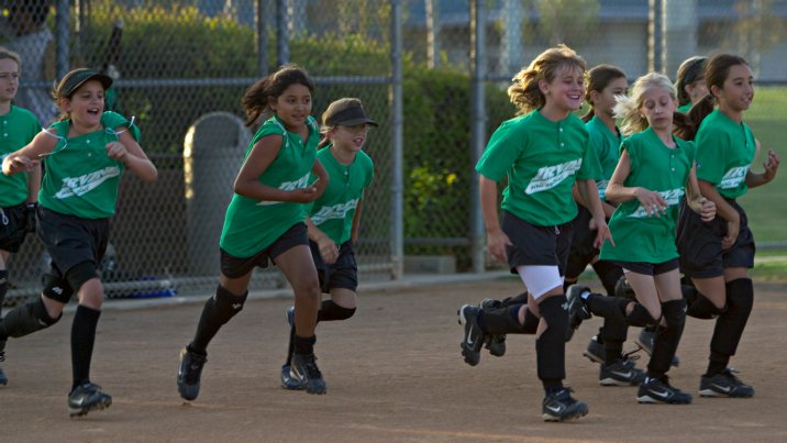The Hot Shots run out to the mound for the post-game cheers