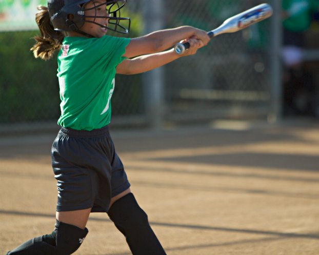 Kayla follows through on a swing