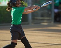 Kayla follows through on a swing