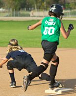 Breanna reaches first before the throw