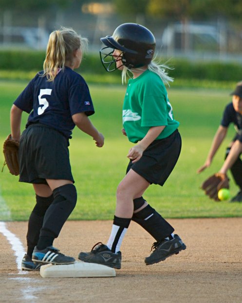 Sara steals third safely on an overthrow