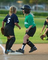 Sara steals third safely on an overthrow