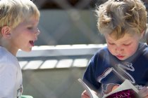 Timothy reads to Adam