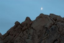 Moon over rocks