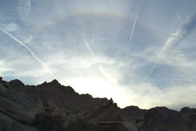 Sunset Rainbow with Silhouetted Figure