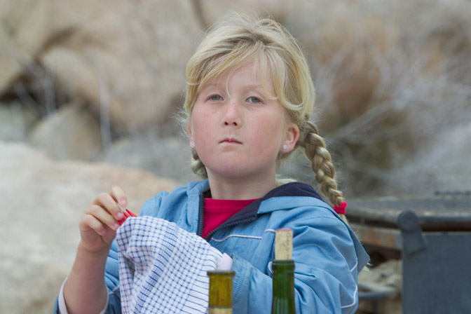 Sara helps wash the breakfast dishes