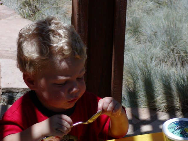 Timothy holding a spoon