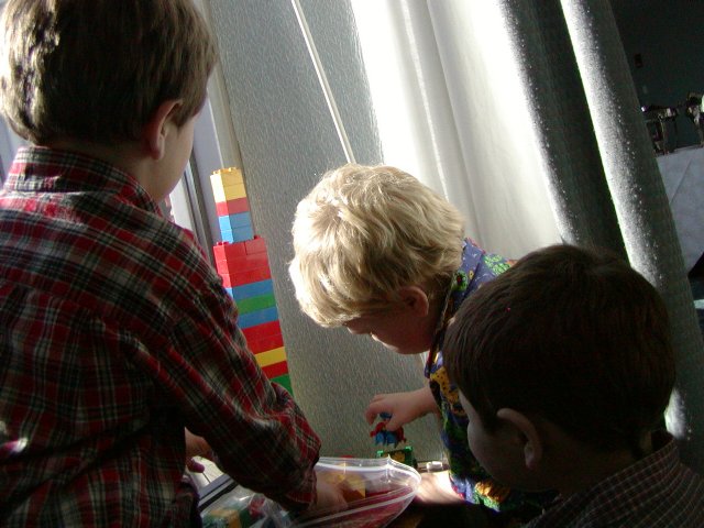 Boys playing in the window