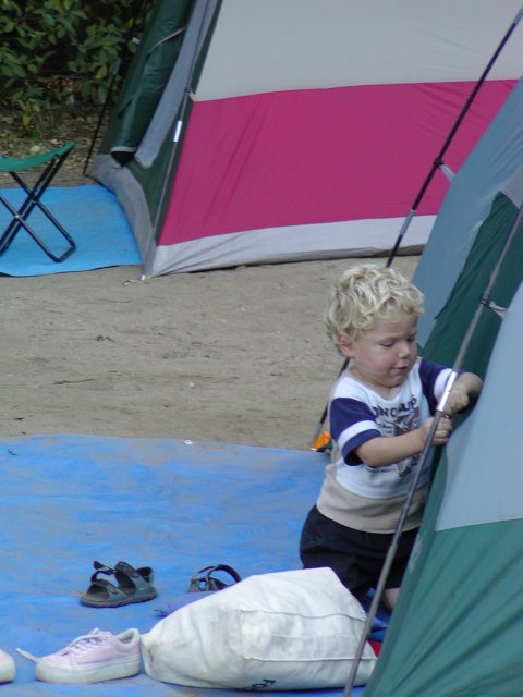 Timothy helps put up the tent