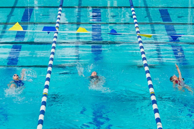 Sara flanked by two other backstrokers