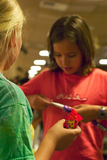 Lee and Sophia trade candy