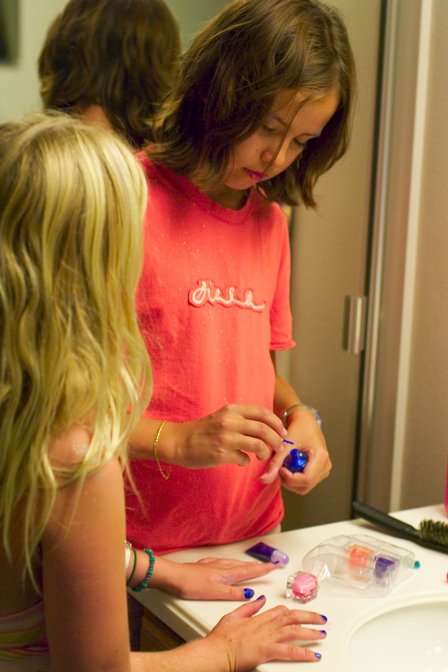 Sophia gives Sara a manicure