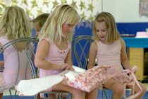 Sara opening Rae's (and Tobin's) present