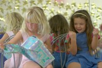 Sara opening Sierra's (and Autumn's) present