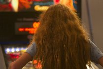 Tobin playing pinball