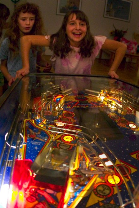 Caitlin playing pinball