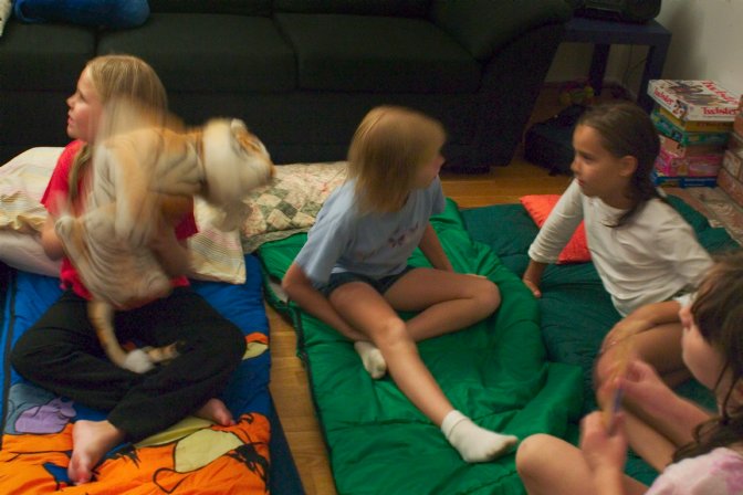 The girls talk after setting out their sleeping bags
