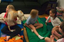 The girls talk after setting out their sleeping bags