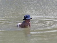 Timothy wades in the lagoon